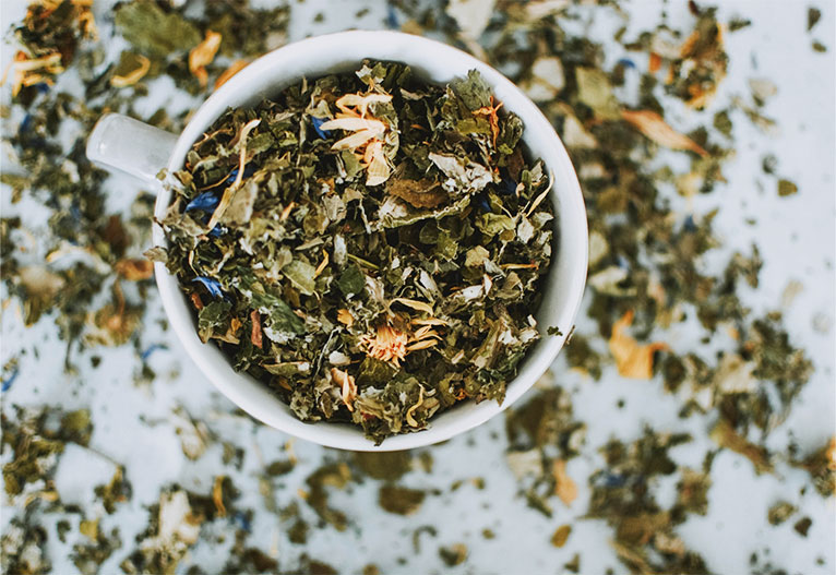 Tea leaves in a small bowl.