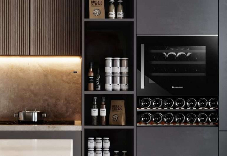 Kleenmaid built-in wine fridge in a black kitchen.