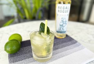 Dry lime and ginger drink next to a bottle of Regal Rogue.
