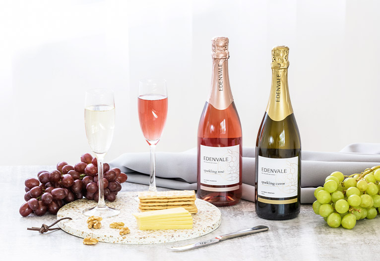 Edenvale sparkling rose and cuvee next to a cheese platter.
