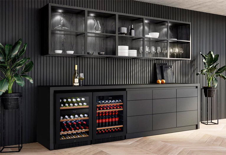 Vintec wine fridge in a black kitchen.