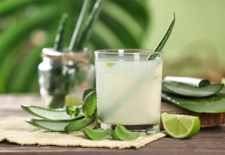 Lime-based mixed drink in a tumbler.