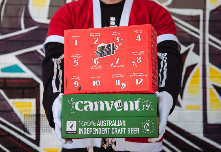 Man holding the Carwyn Cellars Canvent advent calendar 2024.