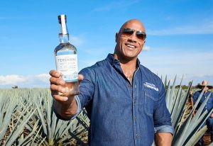 Dwayne The Rock Johnson with a bottle of Teremana Tequila.