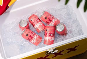 XXXX Tropical Lager cans in a bucket of ice.