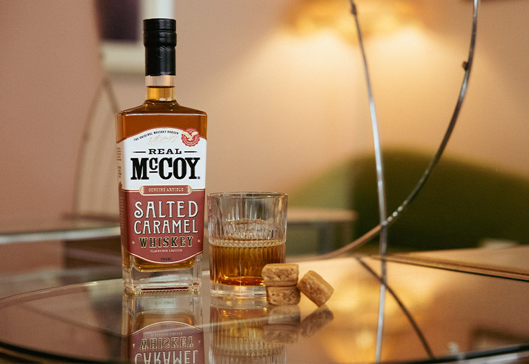Real McCoy Salted Caramel Whiskey bottle on a table.