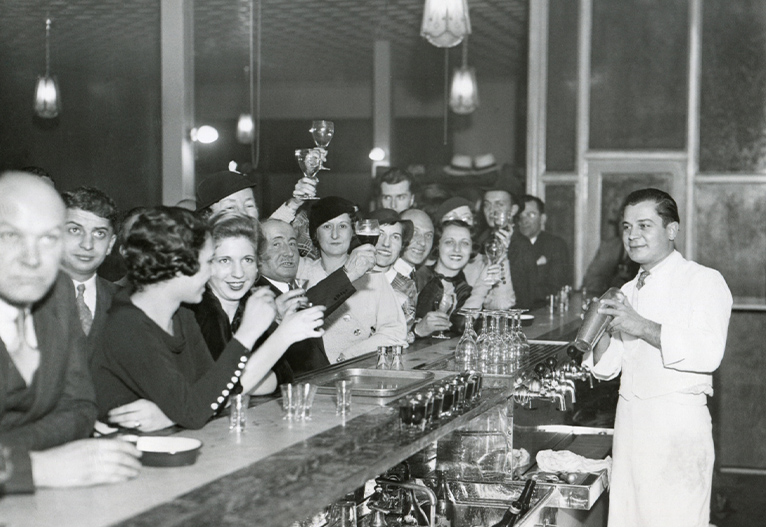 People drinking at a bar at the end of prohibition.