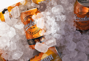 Beenleigh Hard Orange Crush can in ice box.