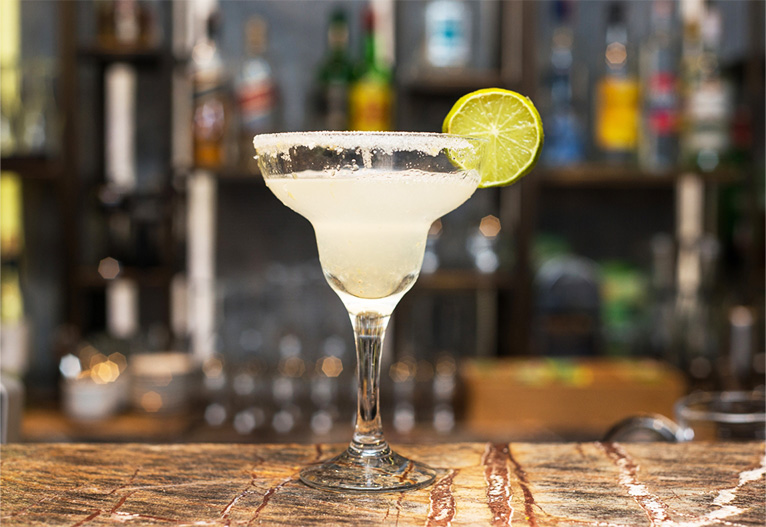 A margarita cocktail on a bar.