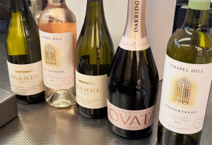 Assorted bottles of wine at a store checkout.