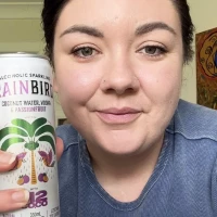 Woman holding a can of Rainbird Coconut Water Vodka Passionfruit.