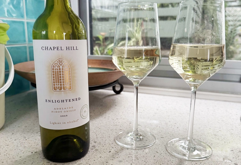 Bottle of Chapel Hill Enlightened Pinot Grigio with two full glasses.