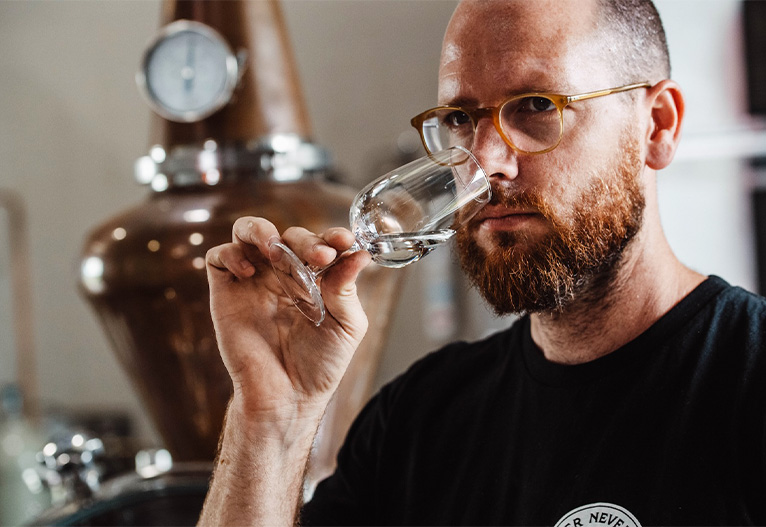 Tim Boast sniffing a spirit in a glass.