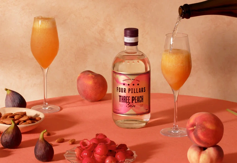 Pouring sparkling wine to make Peach Bellinis.