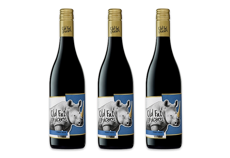 Three bottles of Old Fat Unicorn Pinot Noir wine.